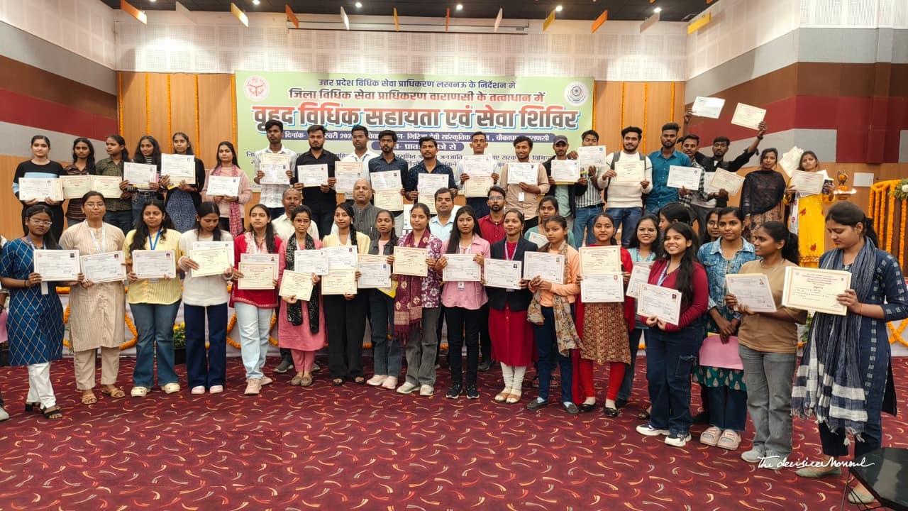 Students receiving certificates at service camp